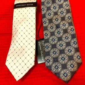 2 nwt designer Fathers Day men’s ties one has the price tag still attached.